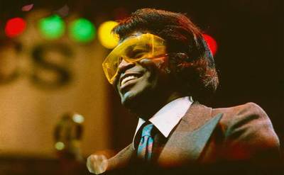 James Brown performs on stage.