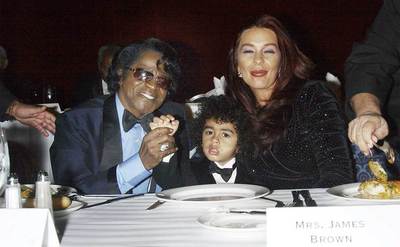 James Brown, son James Brown II and wife Tommy Ray Brown attend the