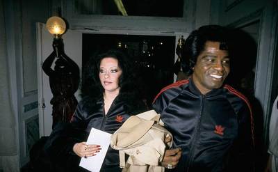 James Brown and Adrienne Rodriguez arrive at a press conference.