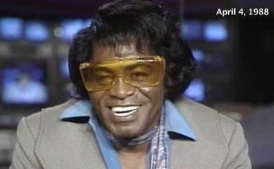 Brown is laughing during a interview.