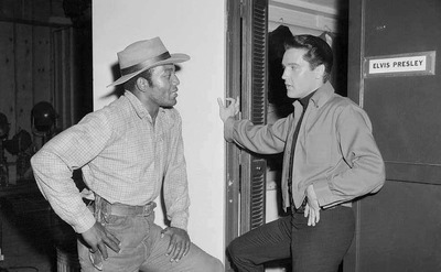 James Brown talks to Elvis outside his dressing room.