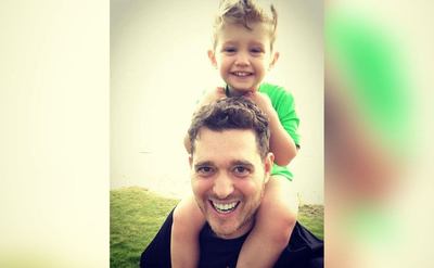 Michael has his son Noah on his shoulders.