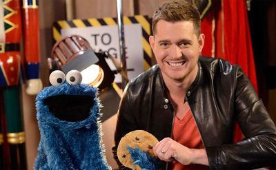 Michael Buble poses with Cookie Monster.