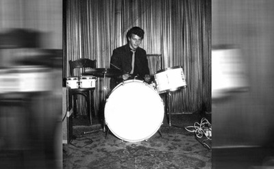 Pete Best behind a drum set