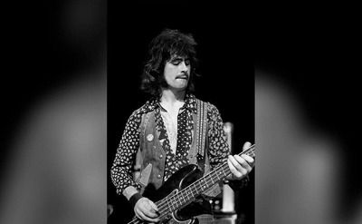 Tommy Evans is performing on stage.