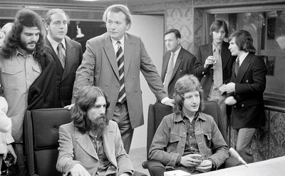 George Harrison listens to playback with Pete Ham of Badfinger in the control room of Apple Studios.