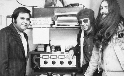 George Harrisonlistens to a master tape of his first solo album in the recording studio.