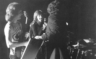 Badfinger is rehearsing on stage.