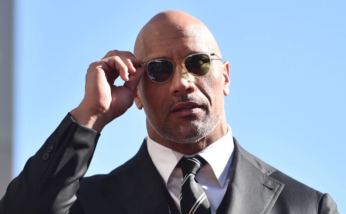 Dwayne Johnson arrives at an event.