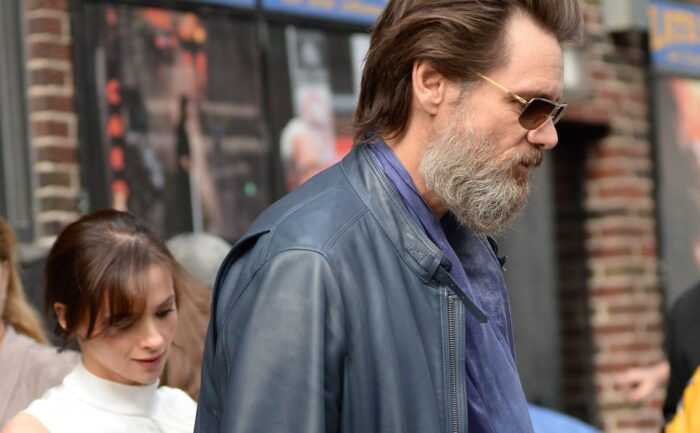Jim Carrey walks the street.