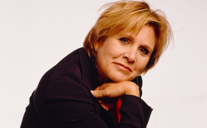 Carrie Fisher poses for a studio portrait.