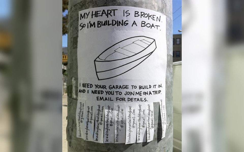 A street poster that reads "my heart is broken"