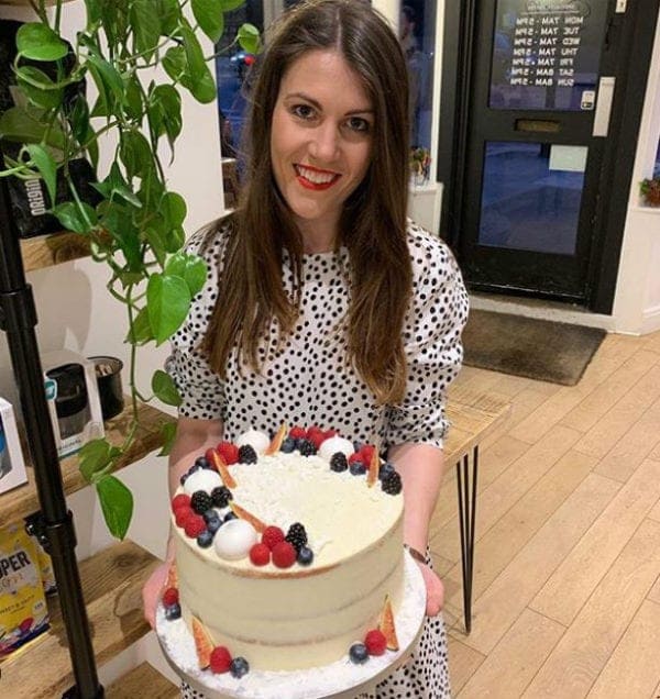 Heidi Parker holding a cake