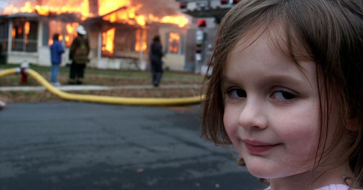 Girl standing in front of house fire