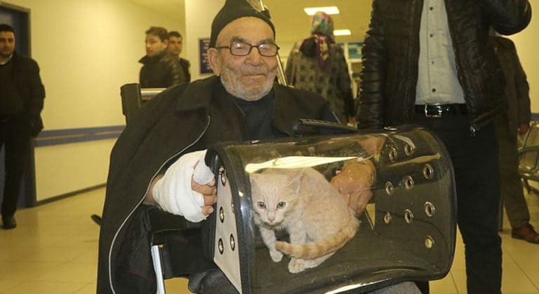 Man leaving hospital with his cat