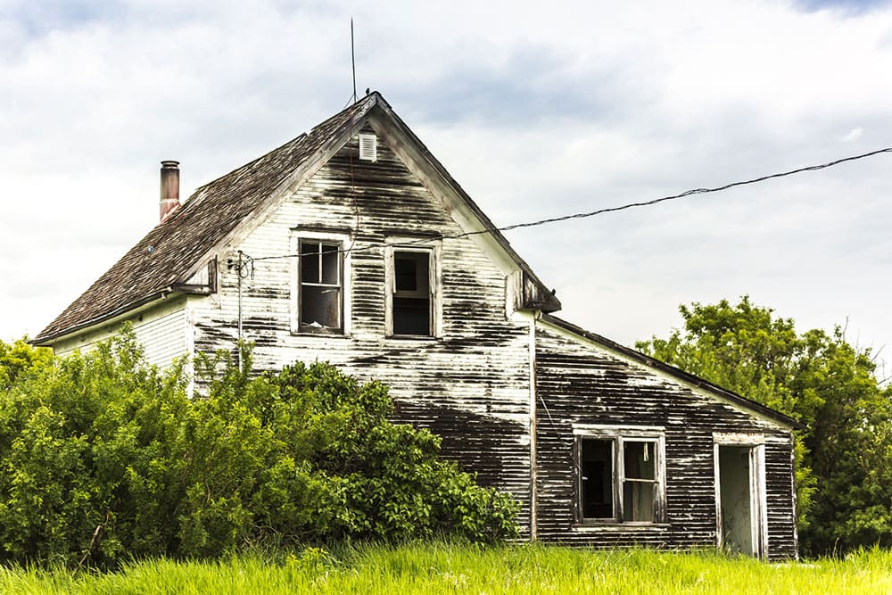 An old abandoned house on a farmyard