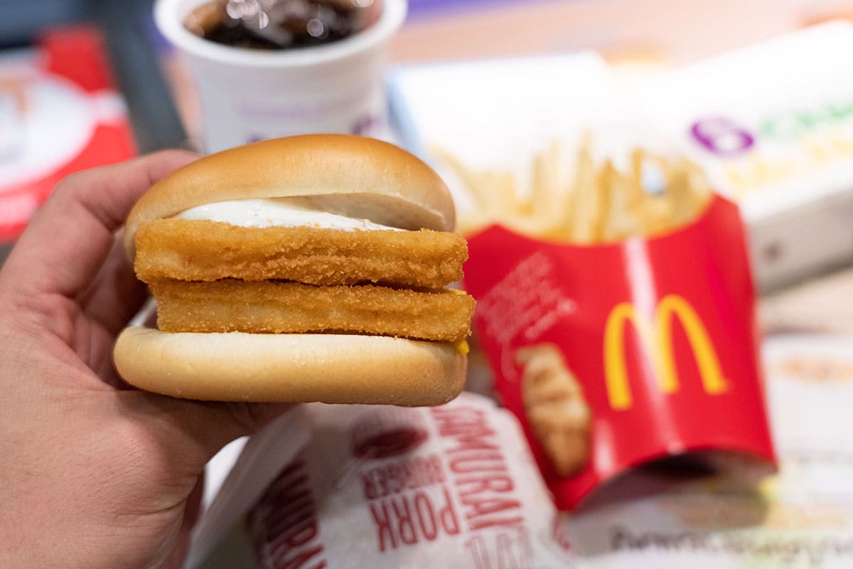 Hand Hold Double Fillet o Fish burger from McDonald's Restaurant