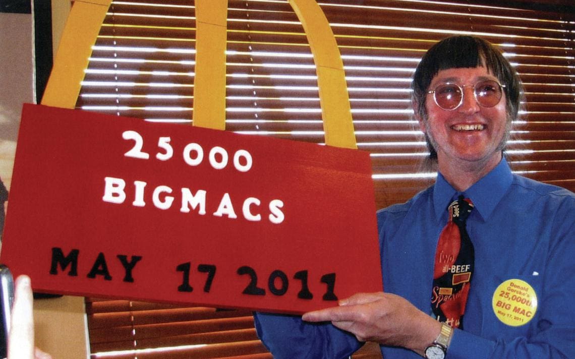 Don Gorske holds up a sign showing how many Big Macs he ate on May 17th, 2011. 
