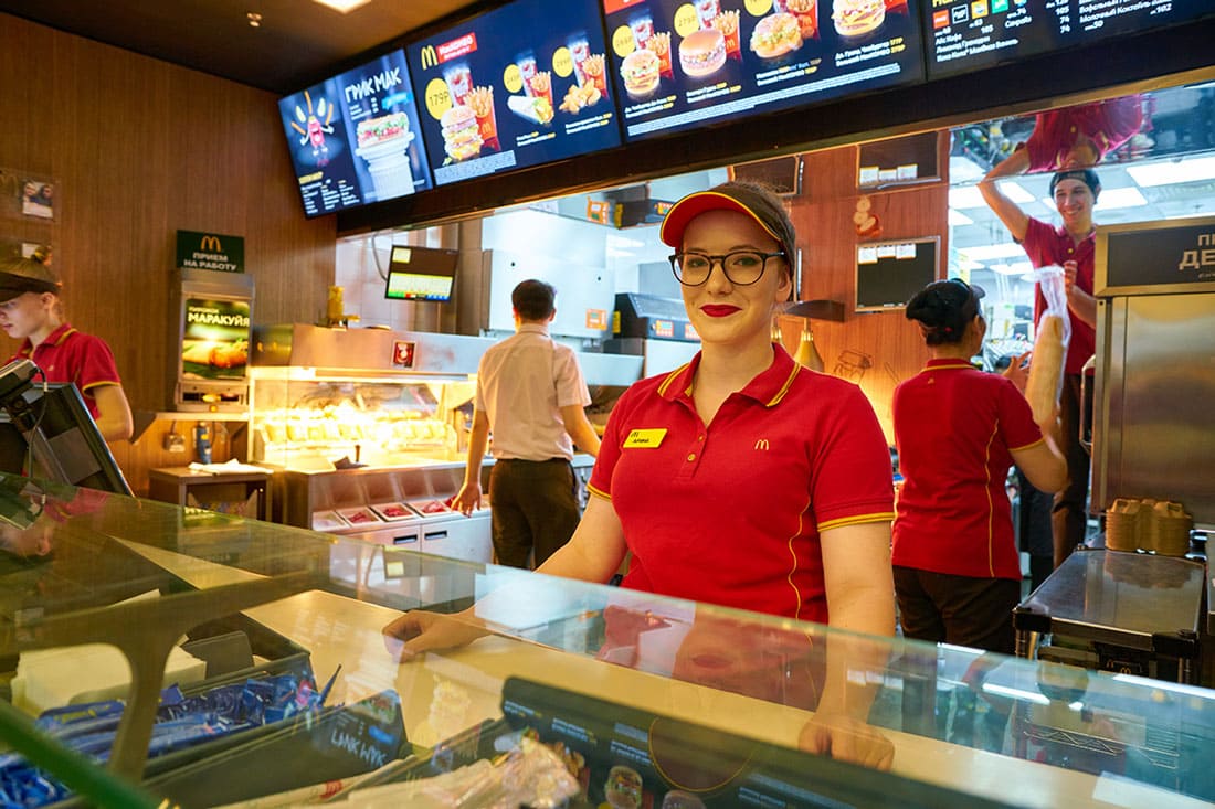  Young worker in McDonald's restaurant in Moscow is pictured above.
