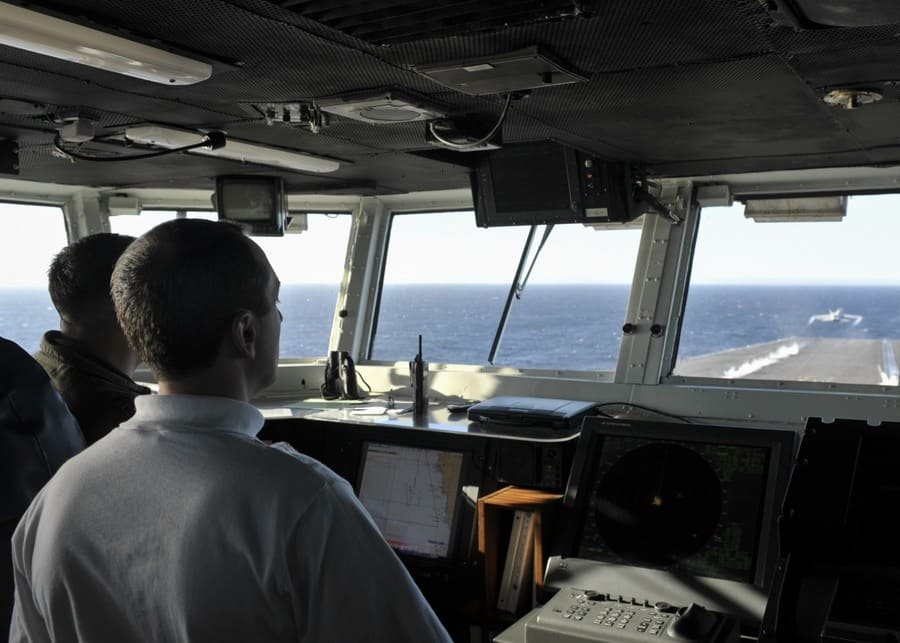 Looking out through ships window on an aircraft carrier