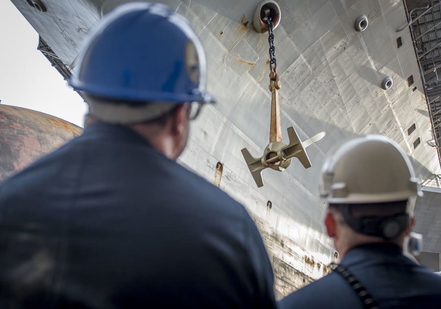 Supervising a ship docking on an aircraft carrier