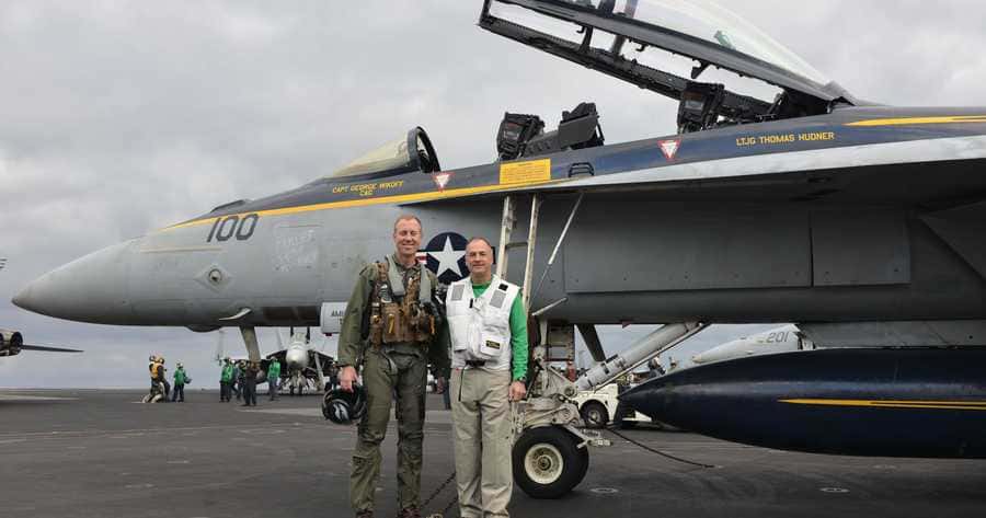 Posing in front of an aircraft