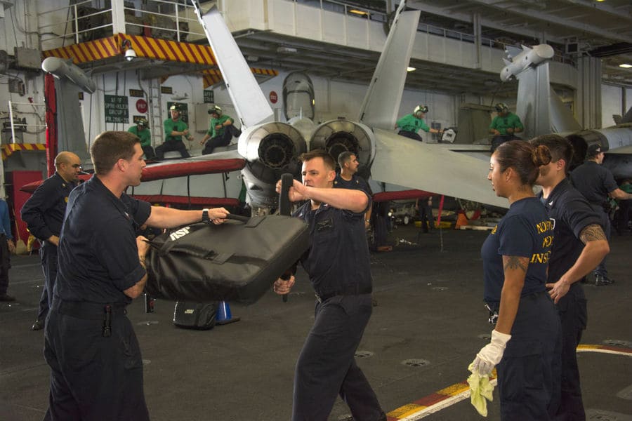 Practicing fighting with non-lethal weapons