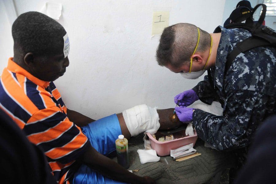 A scientists assisting a survivor