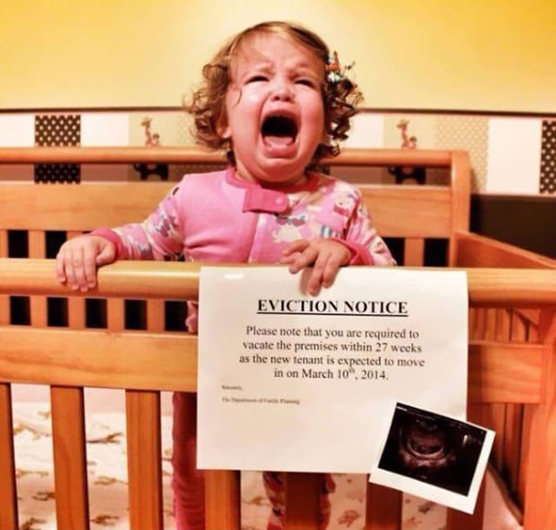  Baby crying and holding a eviction notice 