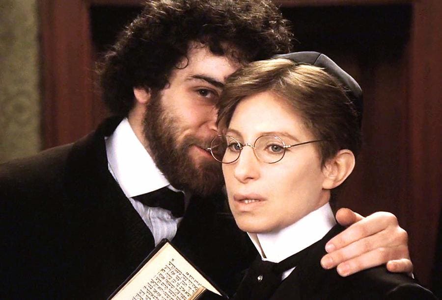 Mandy Patinkin is whispering to Barbra Streisand in the movie Yentl. 
