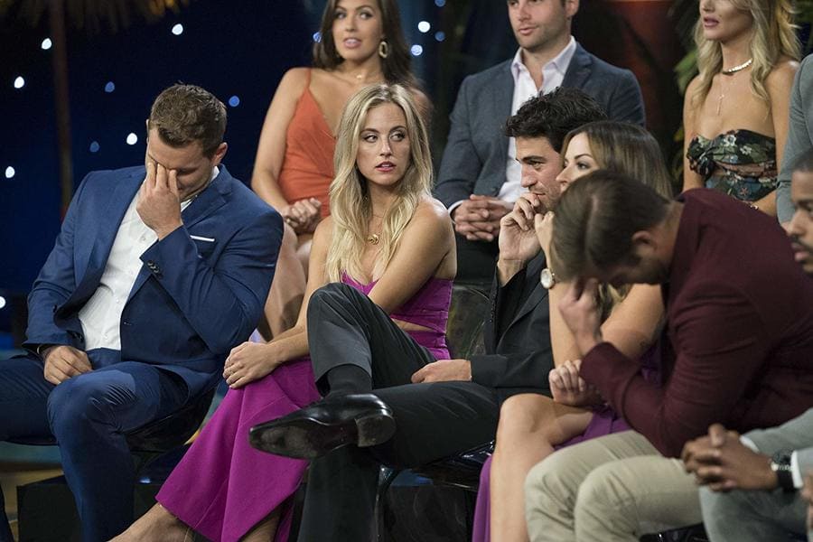 Bachelor in Paradise contestants arguing, and Colton holding his eyebrows in frustration. 