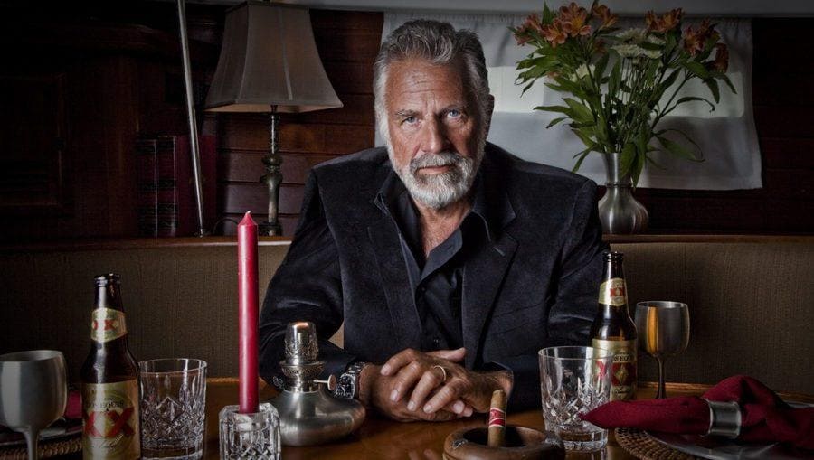 Jonathan Goldsmith sitting in a booth at a bar.