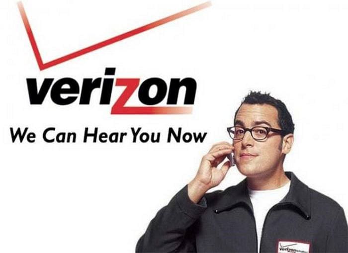Paul Marcelli holding a cellphone with the Verizon logo.