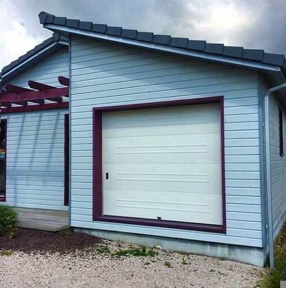 A garage door without a paved road leading to it