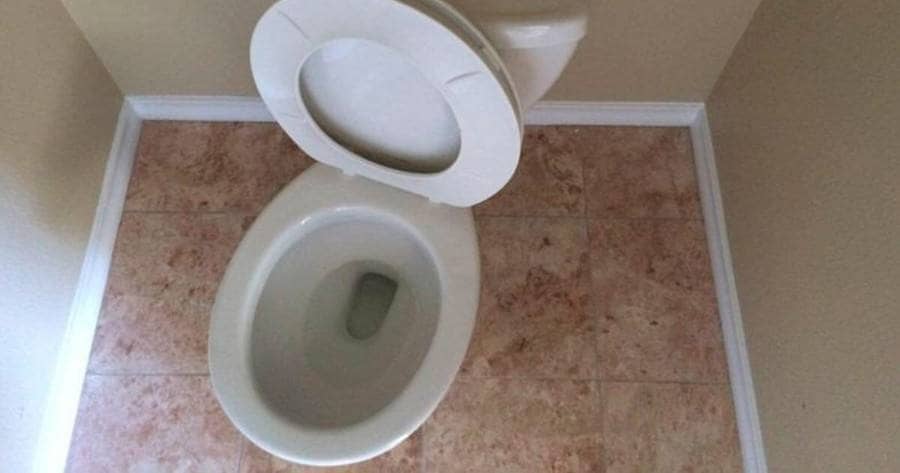A toilet seat on a weird angle