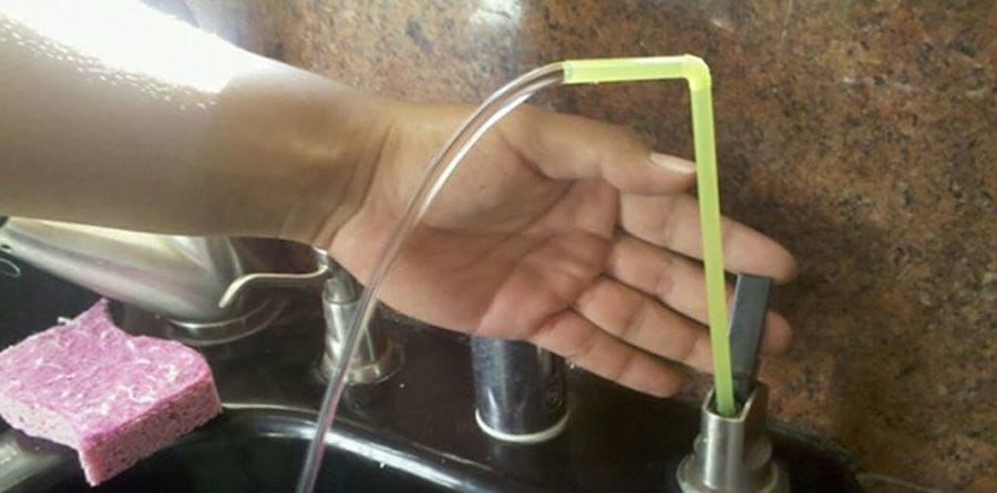 a straw used as a faucet