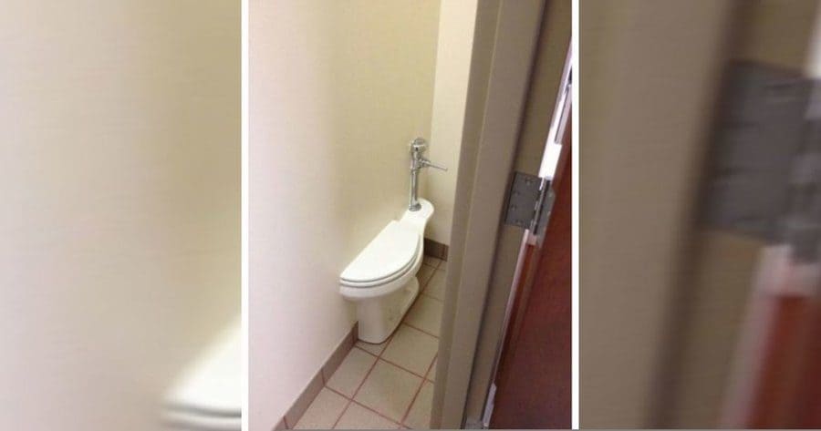 half toilet seat popping out of the wall