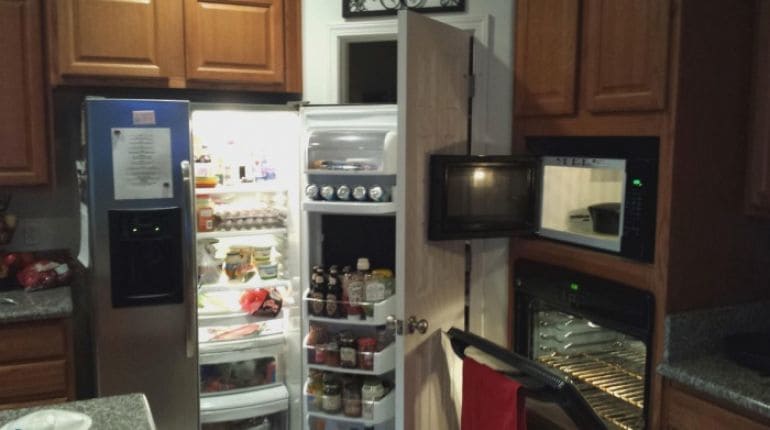 A kitchen with all its doors opened