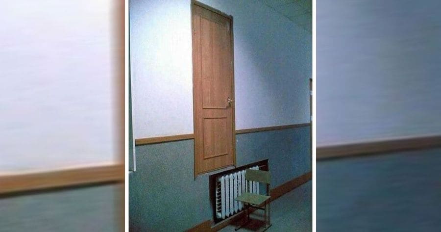 A door hanging from the wall not touching the floor