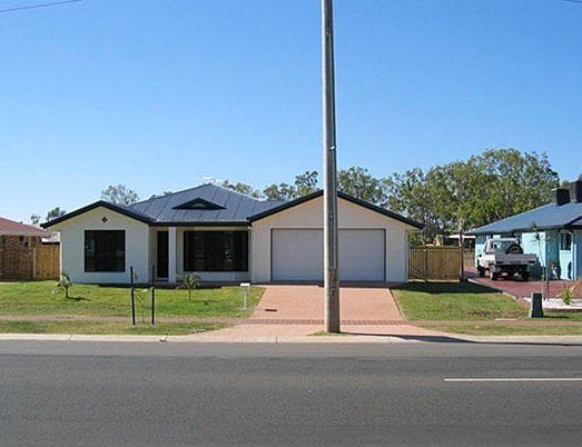 A lamp post blocking entrance to the garage