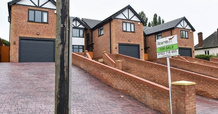 A narrow entrance to a house with no room for a car
