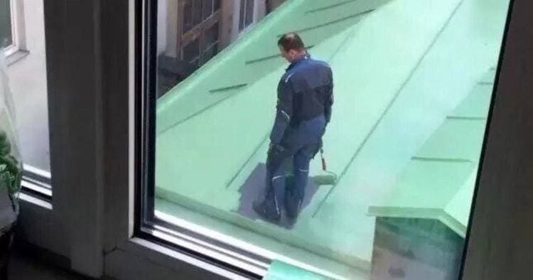 A painter stuck on the roof after painting all of it