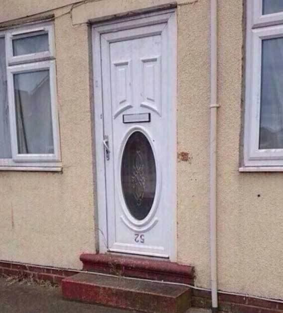 An entrance door installed upside down