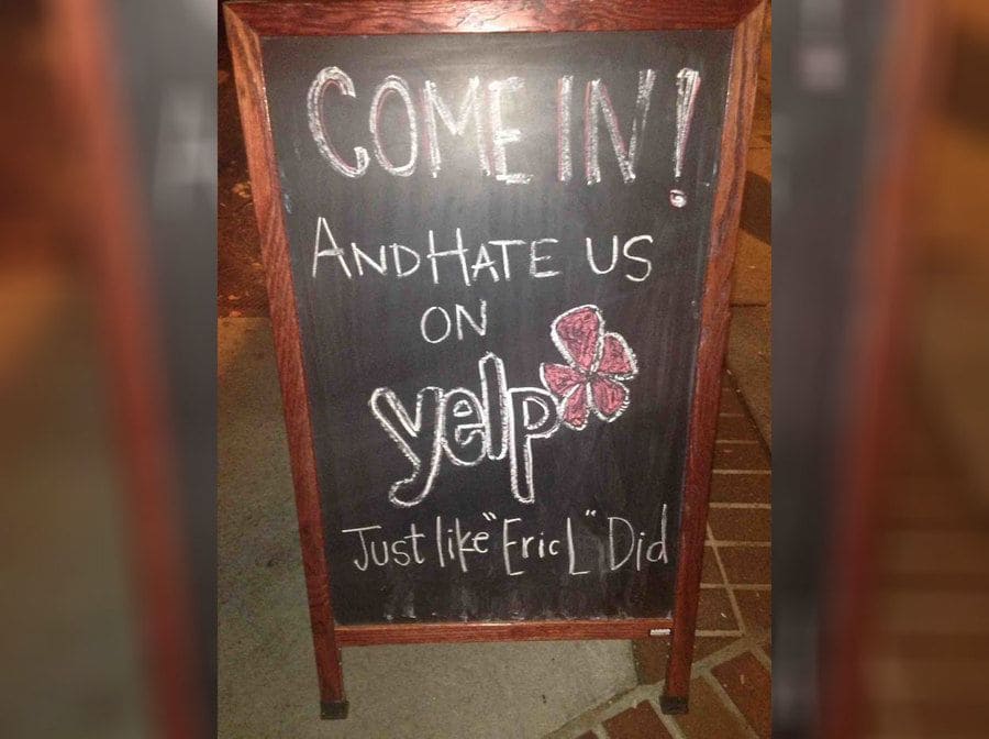 A funny restaurant/bar sign about Yelp trolls 