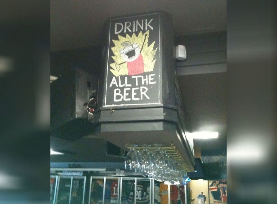 A bar sign telling you to dink 