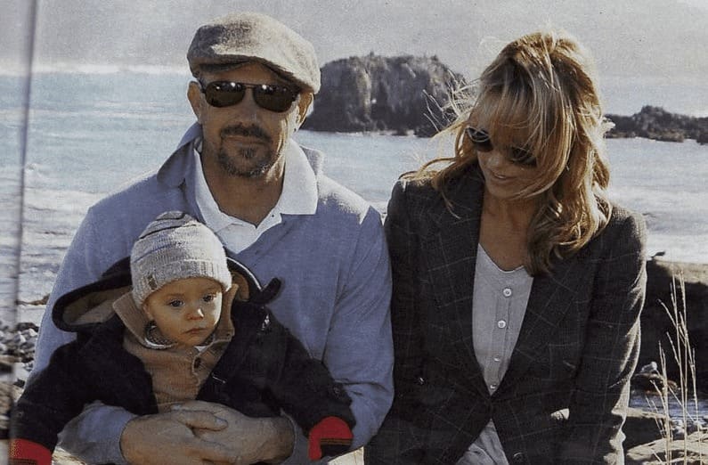 Christine Baumgartner and Kevin Costner holding their baby