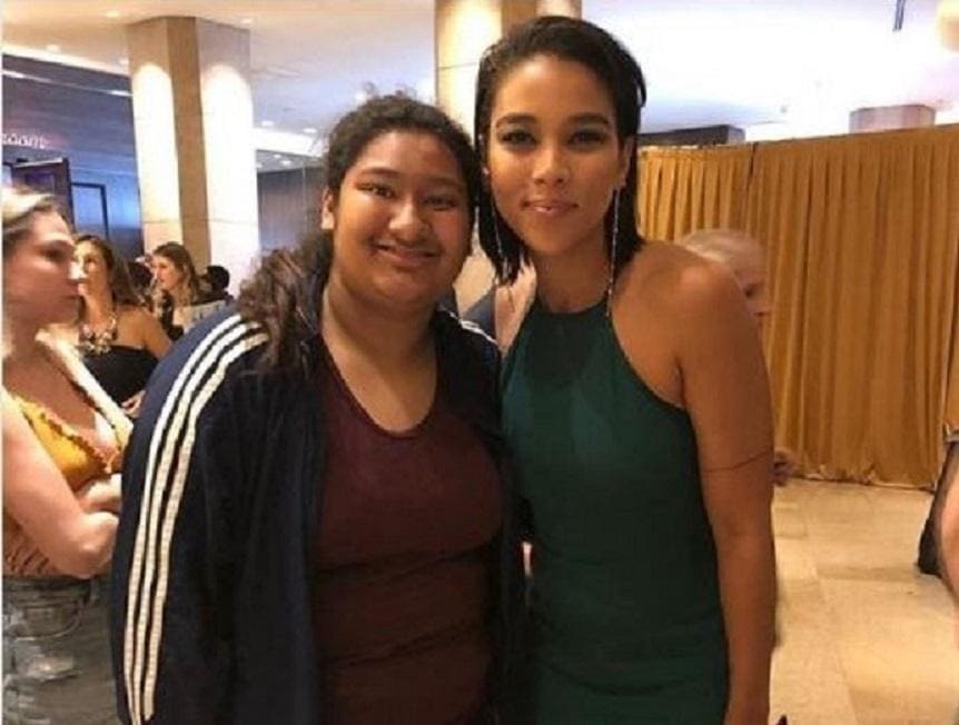 Alexandra Shipp and Marlen are posing for a photograph.