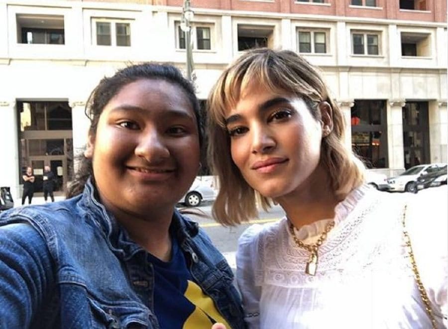 Sofia Boutella and Marlen Orozco are posing together outside of the Theatre at The Ace Hotel in LA.