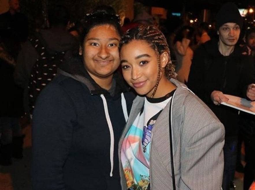 Amanda and Marlen are posing together for a photograph.