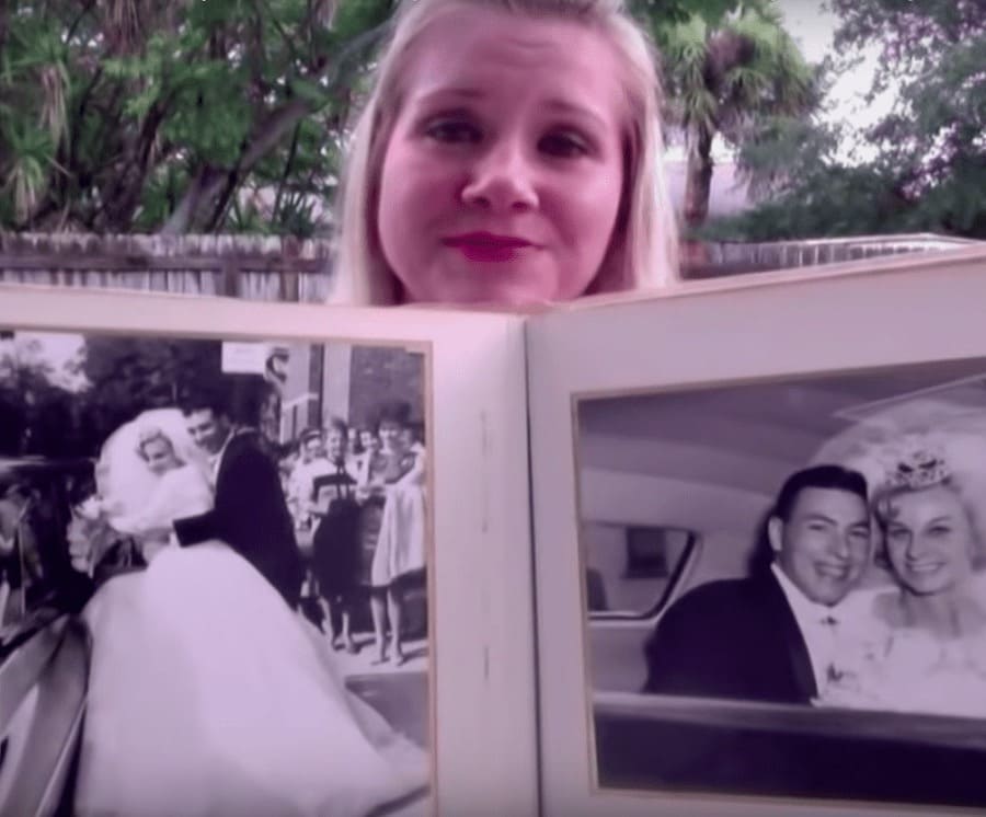 Megan and Bobby Kapsidis with their two dogs and the vintage wedding photo